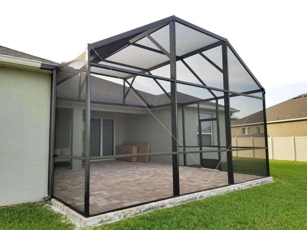 Aluminum lanai screen enclosure installation in Deltona, FL attached to residential patio