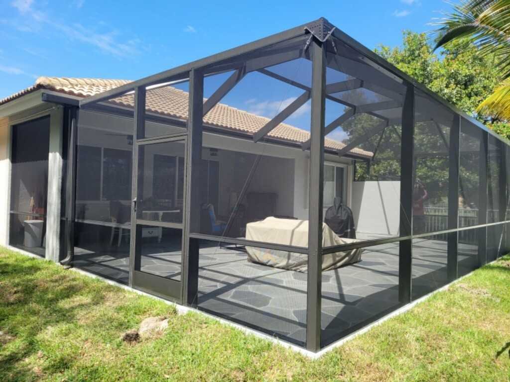 Backyard lanai screen enclosure installation in Deltona, FL attached to residential lanai
