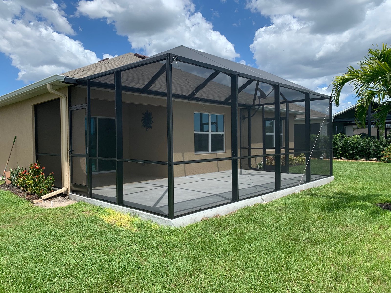Completed patio screen enclosure installation in Deltona, FL on residential backyard patio