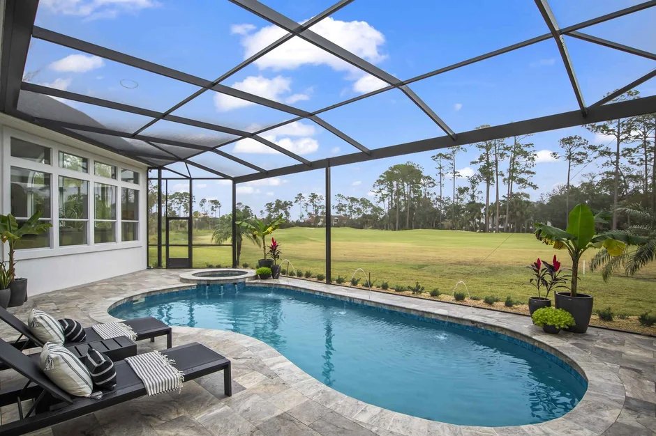 Pool screen enclosure builders in Deltona, FL covering modern backyard swimming pool